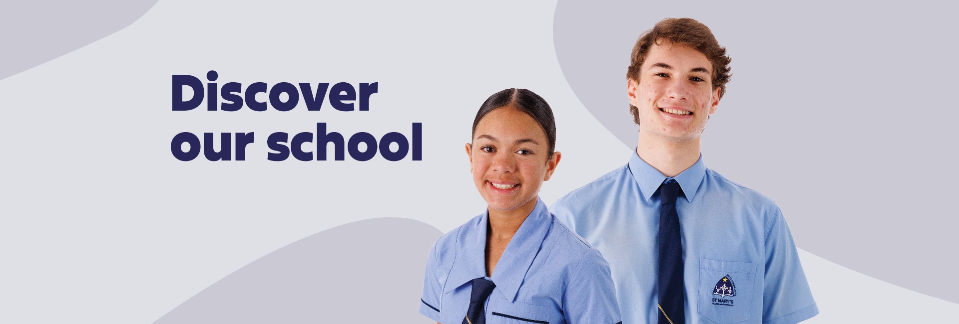 Two students with a sign saying "Discover our school"